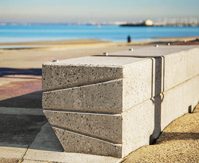 Geometric concrete and timber benches, made by SVC for the City of Port Phillip, line the St Kilda Foreshore.