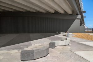 SVC three-colour concrete bench modules and hexagonal pavers at the Sydenham Level Crossing Removal.