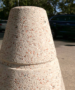 Red brick aggregates in this bollard give it a hint of vibrant red.