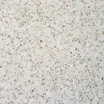 Cream-coloured concrete swatch featuring small coloured pebbles